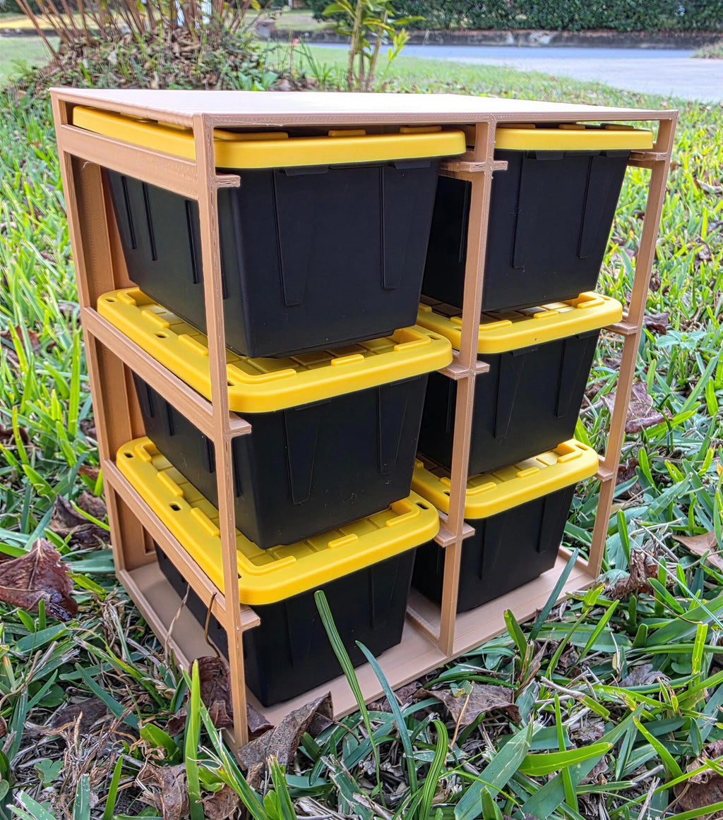 A wooden storage rack with six black plastic containers stacked on top of each other, placed on a grassy area.