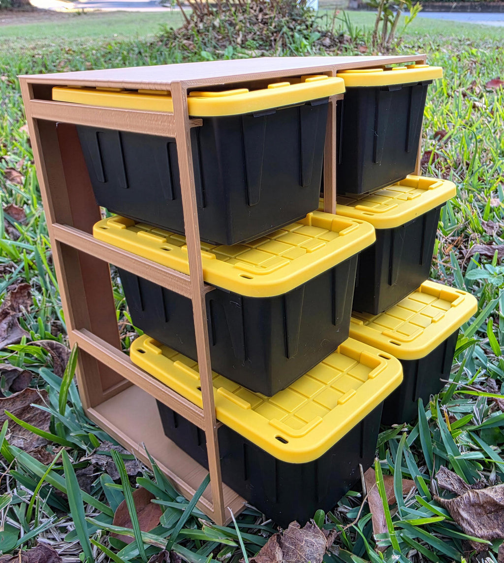 A wooden shelf with six black storage bins stacked on top of each other, with yellow lids, placed on a grassy area.